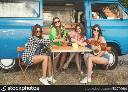 Summer holidays, road trip, vacation, travel and people concept - smiling young hippie women in car