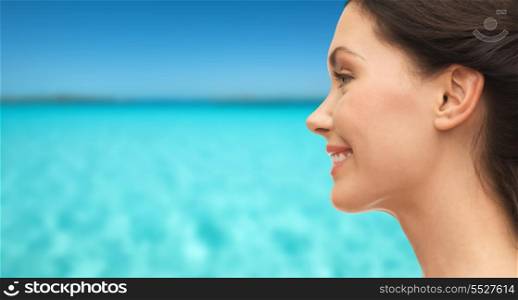 summer holidays, tourism and beauty concept - smiling woman