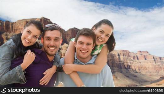 summer holidays, tourism and travel concept - group of happy friends or couples over grand canyon national park background. group of happy friends. group of happy friends