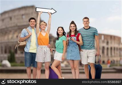 summer holidays, tourism and vacation concept - group of happy friends with travel bags, camera and arrow over coliseum background. friends with travel bags and arrow over coliseum