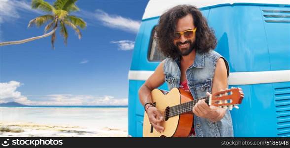 summer holidays, travel, music and people concept - young hippie man playing guitar at minivan car over tropical beach background. hippie man playing guitar at minivan car on beach