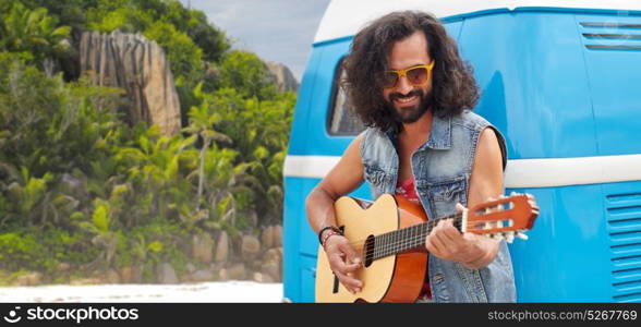 summer holidays, travel, music and people concept - young hippie man playing guitar at minivan car over tropical island beach background. hippie man playing guitar at minivan car on island