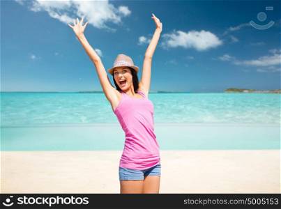 summer holidays, travel, people and vacation concept - happy young woman in hat over exotic tropical beach background. happy young woman in hat on summer beach
