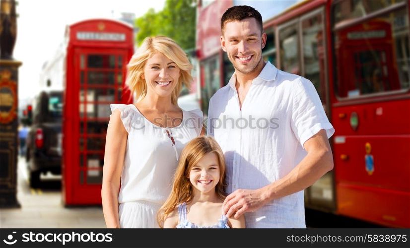 summer holidays, travel, tourism and people concept - happy family over london city street background