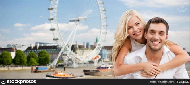 summer holidays, travel, tourism, people and dating concept - happy couple hugging over london ferry wheel background