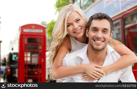 summer holidays, travel, tourism, people and dating concept - happy couple hugging over london city street background