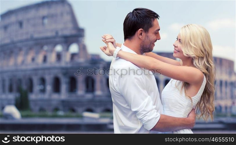 summer holidays, travel, tourism, people and dating concept - happy couple hugging over coliseum background