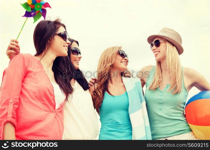 summer holidays, vacation and beach activities - girls having fun on the beach