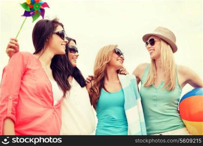summer holidays, vacation and beach activities - girls having fun on the beach