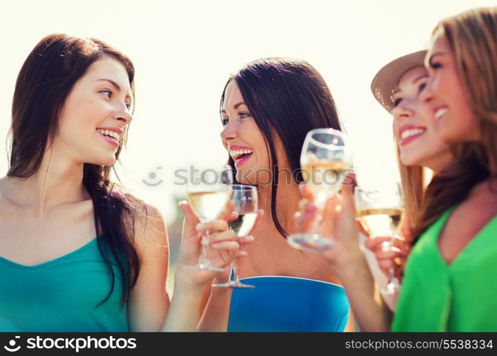 summer holidays, vacation and celebration - girls with champagne glasses