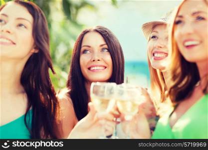 summer holidays, vacation and celebration - girls with champagne glasses
