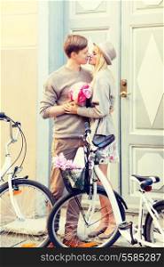 summer holidays, vacation, bikes, love and relationship concept - couple with bicycles in the city