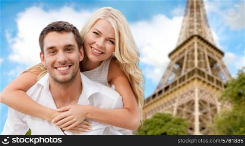summer holidays, vacation, dating and travel concept - happy couple having fun over eiffel tower background