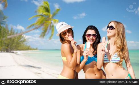 summer holidays, vacation, food, travel and people concept - group of smiling young women eating ice cream over exotic tropical beach with palm trees background