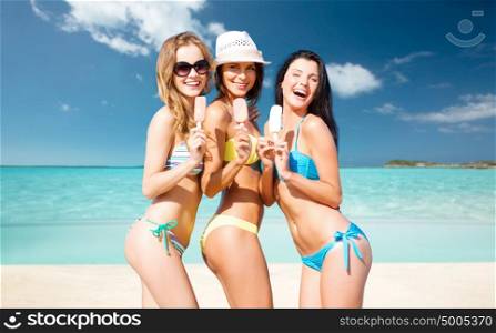 summer holidays, vacation, food, travel and people concept - group of smiling young women eating ice cream over exotic tropical beach background. group of smiling women eating ice cream on beach
