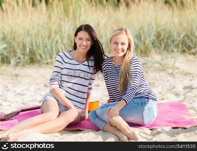 summer, holidays, vacation, happy people concept - beautiful teenage girls or young women having fun on the beach