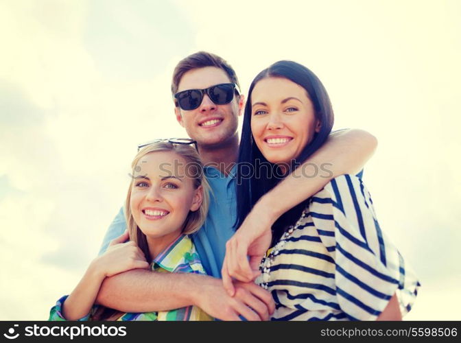 summer, holidays, vacation, happy people concept - group of friends having fun on the beach