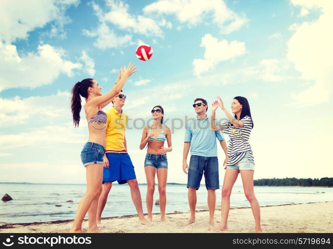 summer, holidays, vacation, happy people concept - group of friends having fun on the beach