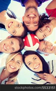 summer, holidays, vacation, happy people concept - group of teenagers with ball looking down