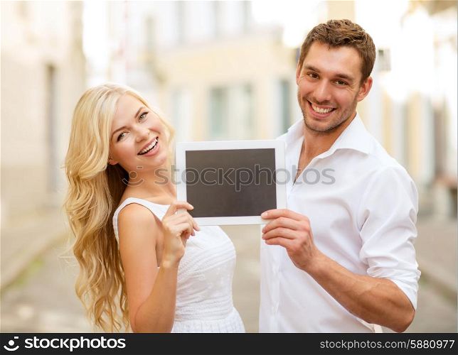 summer holidays, wedding, dating and technology concept - couple with tablet pc in the city