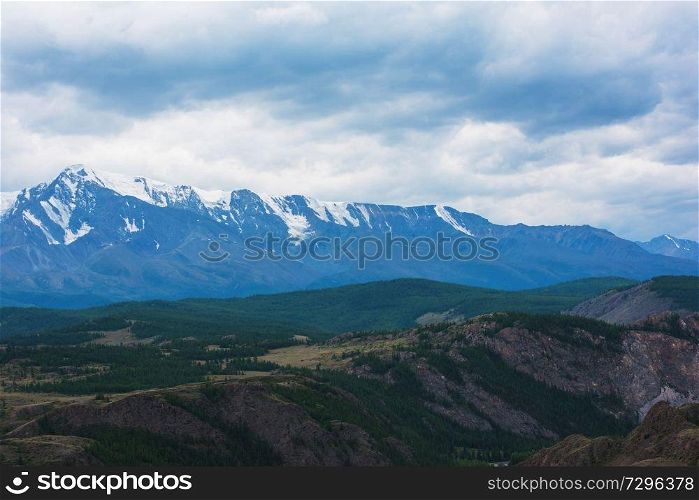 Summer in Kurai steppe and North-Chui ridge of Altai mountains, Russia. Cloud day.. Kurai steppe and North-Chui ridge