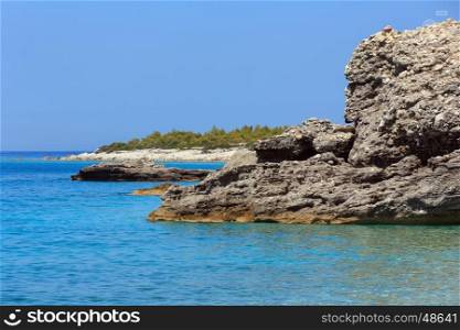 Summer Ionian sea rocky coast view (Drymades beach, Albania).