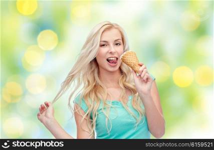 summer, junk food and people concept - young woman in sunglasses eating ice cream over green lights background