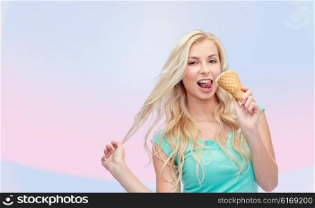 summer, junk food and people concept - young woman in sunglasses eating ice cream over pink background