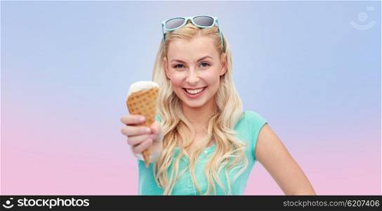 summer, junk food and people concept - young woman or teenage girl in sunglasses eating ice cream over rose quartz and serenity gradient background