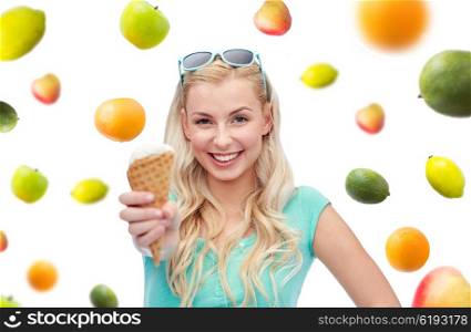 summer, junk food, healthy eating and people concept - young woman or teenage girl in sunglasses eating ice cream over fruits on white background