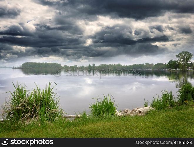 Summer Lake And Sky With Stormy Clouds