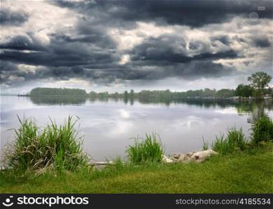 Summer Lake And Sky With Stormy Clouds