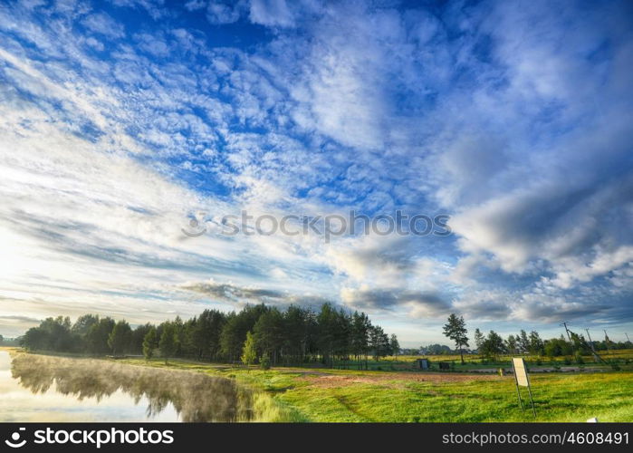 summer landscape. blue sky, clouds and water