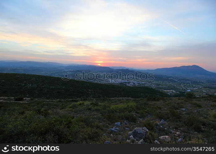 Summer landscape in mountains with the sun