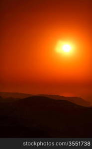 Summer landscape in mountains with the sun