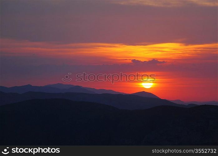 Summer landscape in mountains with the sun