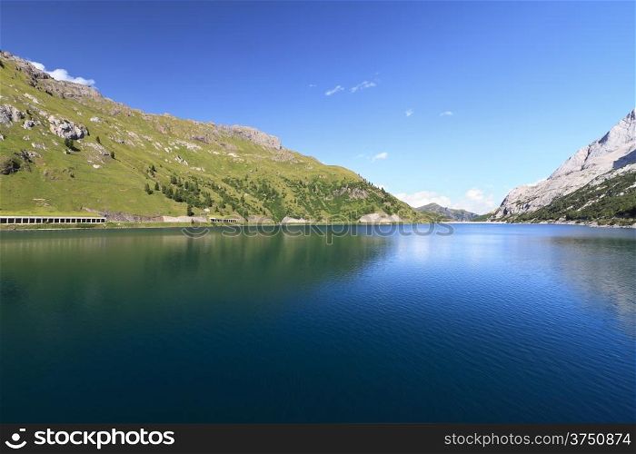 summer landscape of Fedaia lake and pass, Trentino, Italy
