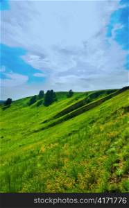summer landscape of green valley and blue sky