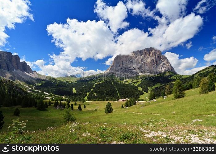 summer landscape of high Gardena valley with Sassolungo mount, Italian Dolomites