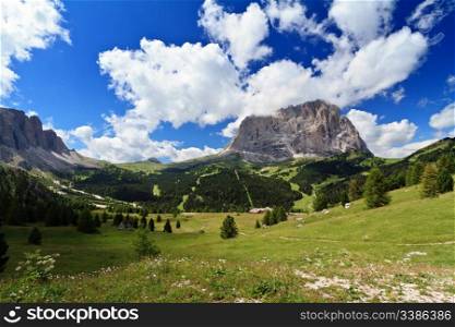 summer landscape of high Gardena valley with Sassolungo mount, Italian Dolomites