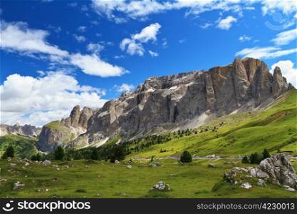 summer landscape of Sella mountain and Gardena valley from Sella pass, Italian Dolomites