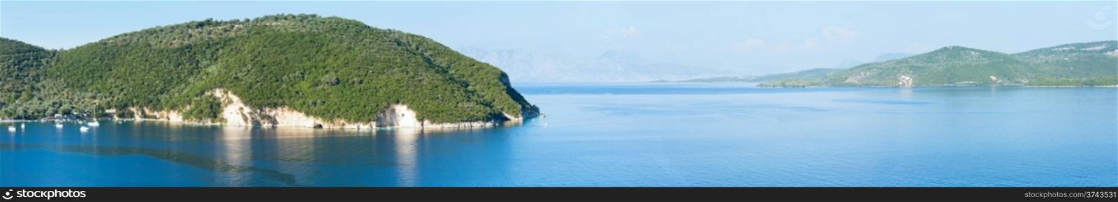 Summer Lefkada coastline panorama and sailers in bay (Nydri , Greece).