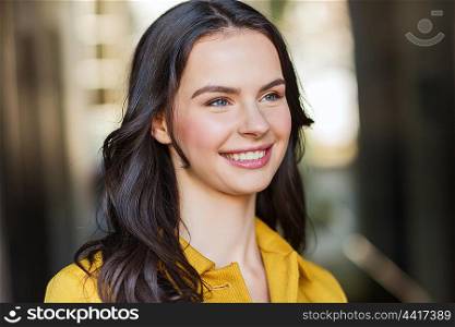 summer, leisure, vacation and people concept - smiling young woman in city