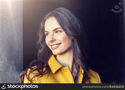 summer, leisure, vacation and people concept - smiling young woman in city. smiling young woman in city