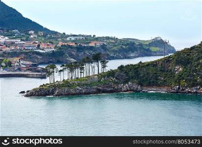 Summer Lekeitio town coasline and San Nicolas island (isla de San Nicolas), Biscay, Spain, Basque Country.