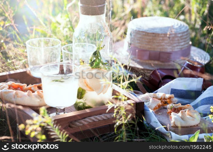 Summer - lemonade with lemon and mint with apricot biscuit and a basket