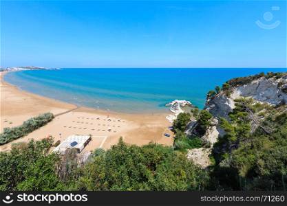 Summer Lido di Portonuovo Adriatic sea beach view (Vieste, Gargano peninsula, Puglia, Italy). People unrecognizable.