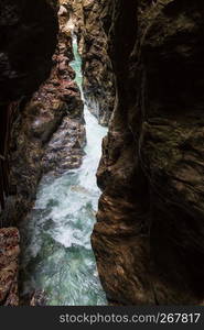 Summer Liechtensteinklamm gorge with stream and waterfalls in Austria.