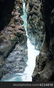 Summer Liechtensteinklamm gorge with stream and waterfalls in Austria.