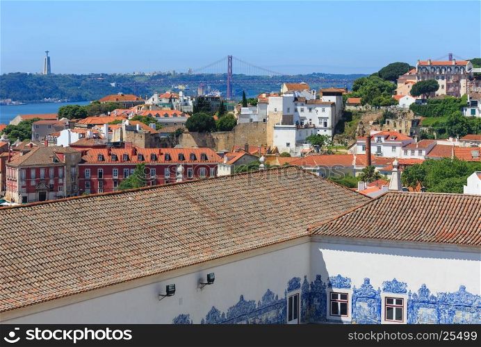 Summer Lisbon cityscape. View from Monastery roof, Portugal. All people are unrecognized.